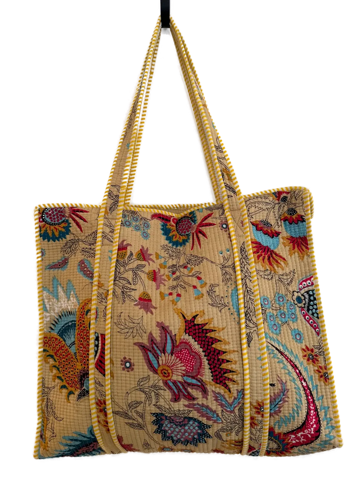 a joyful quilted totebag with a lively multicoloured floral print.