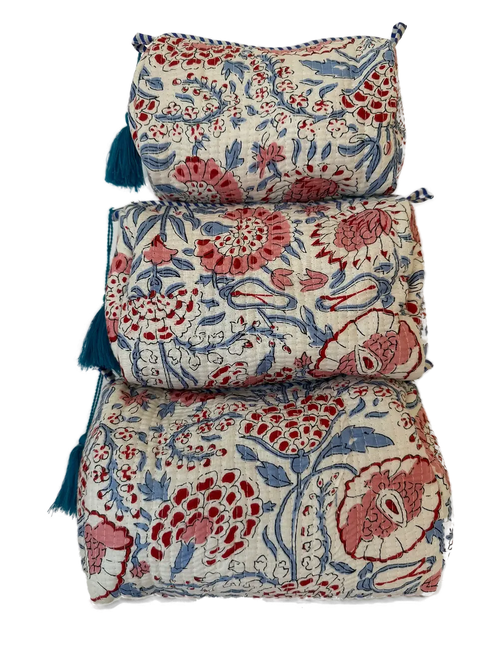 a quilted cotton pouch set with playful floral print in soft red, pink, and blue tones.