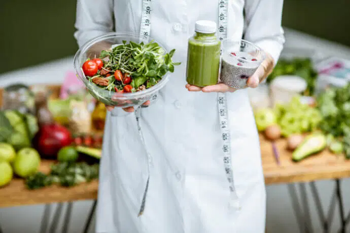 nutritionist-with-healthy-green-food-2021-09-02-04-29-29-utc-scaled-e1636405219626 (2).web