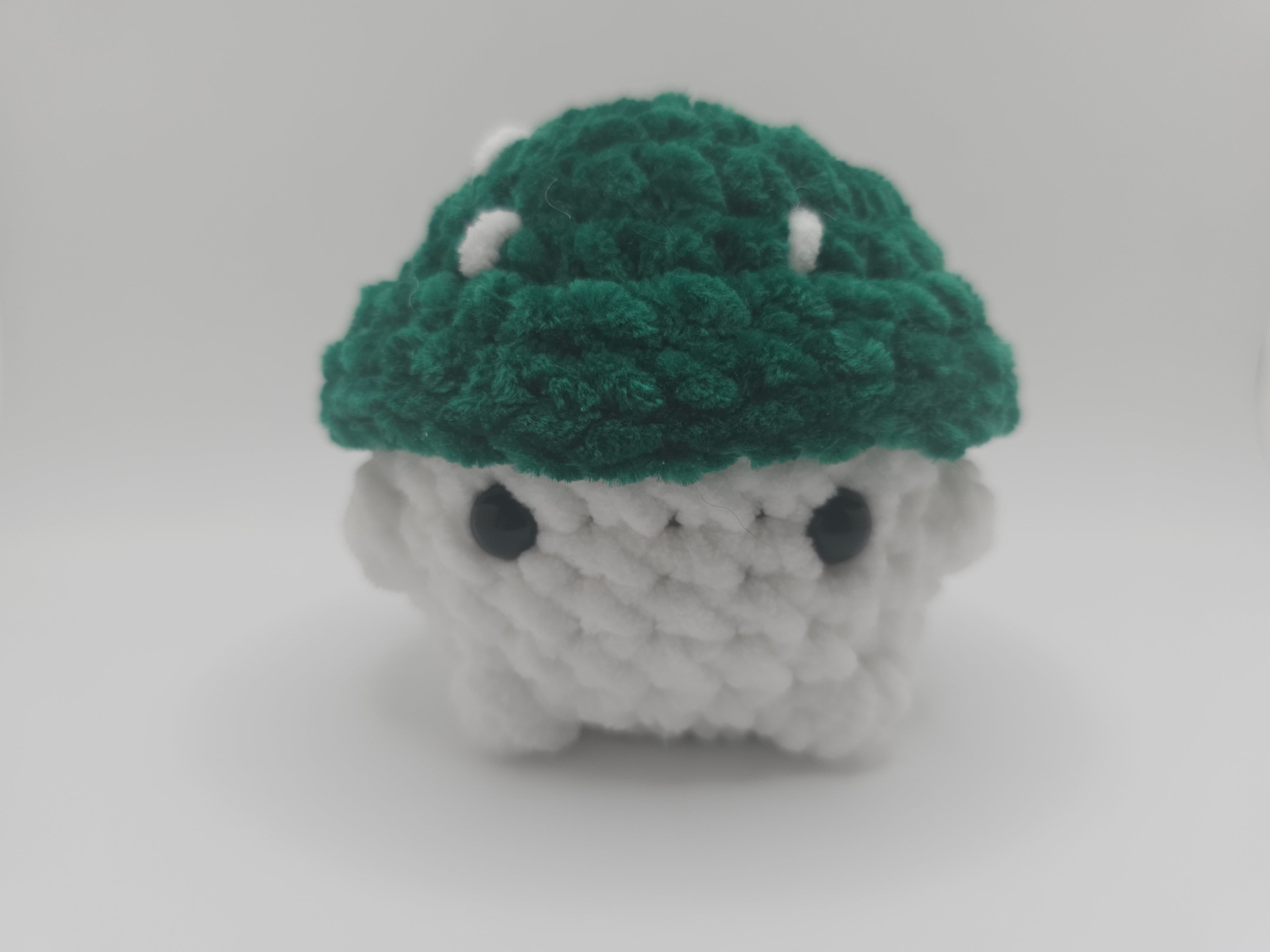 Small handmade crochet mushroom with green cap and white base