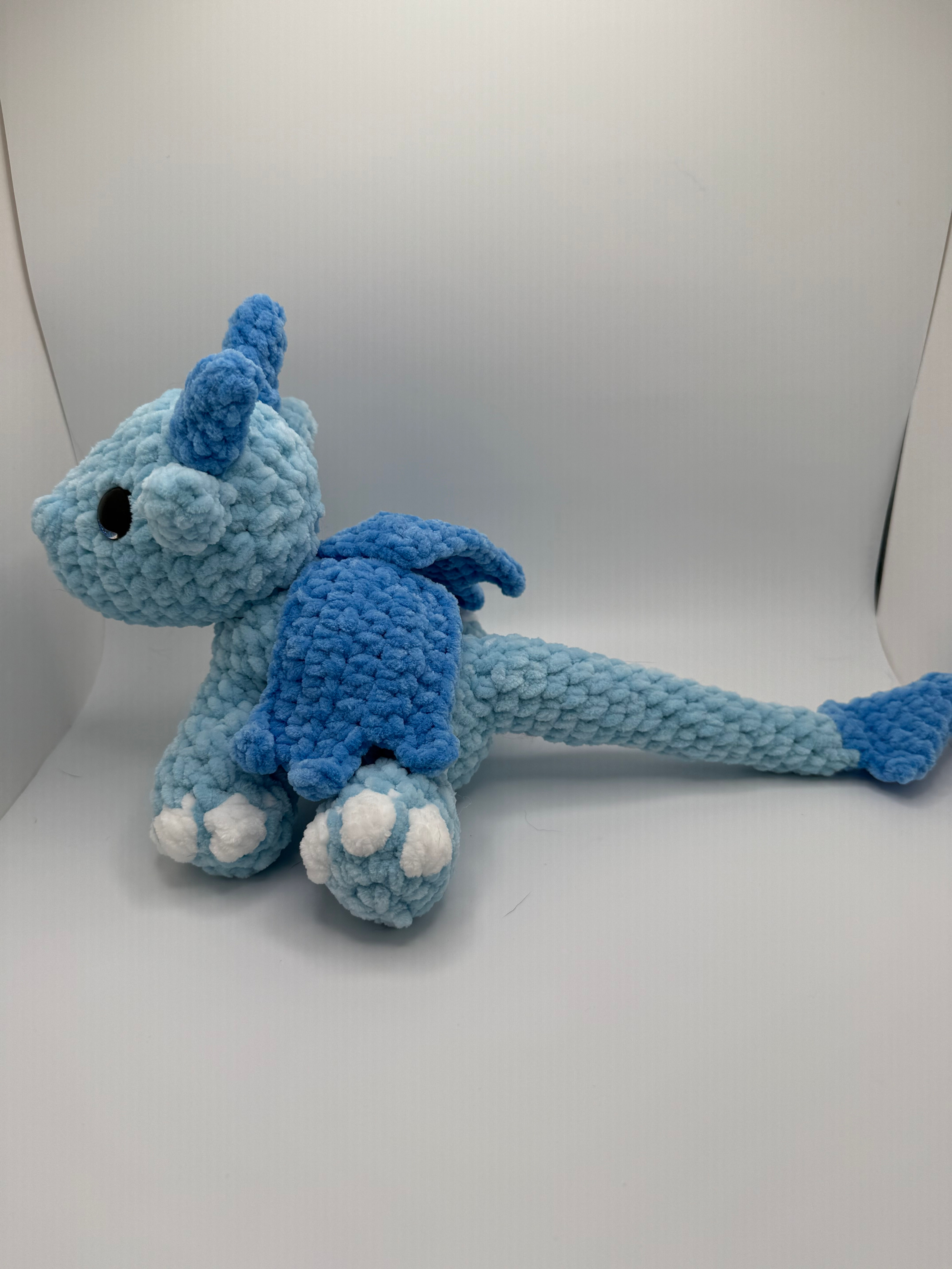 Profile of a blue Amigurumi Dragon Hatchling.