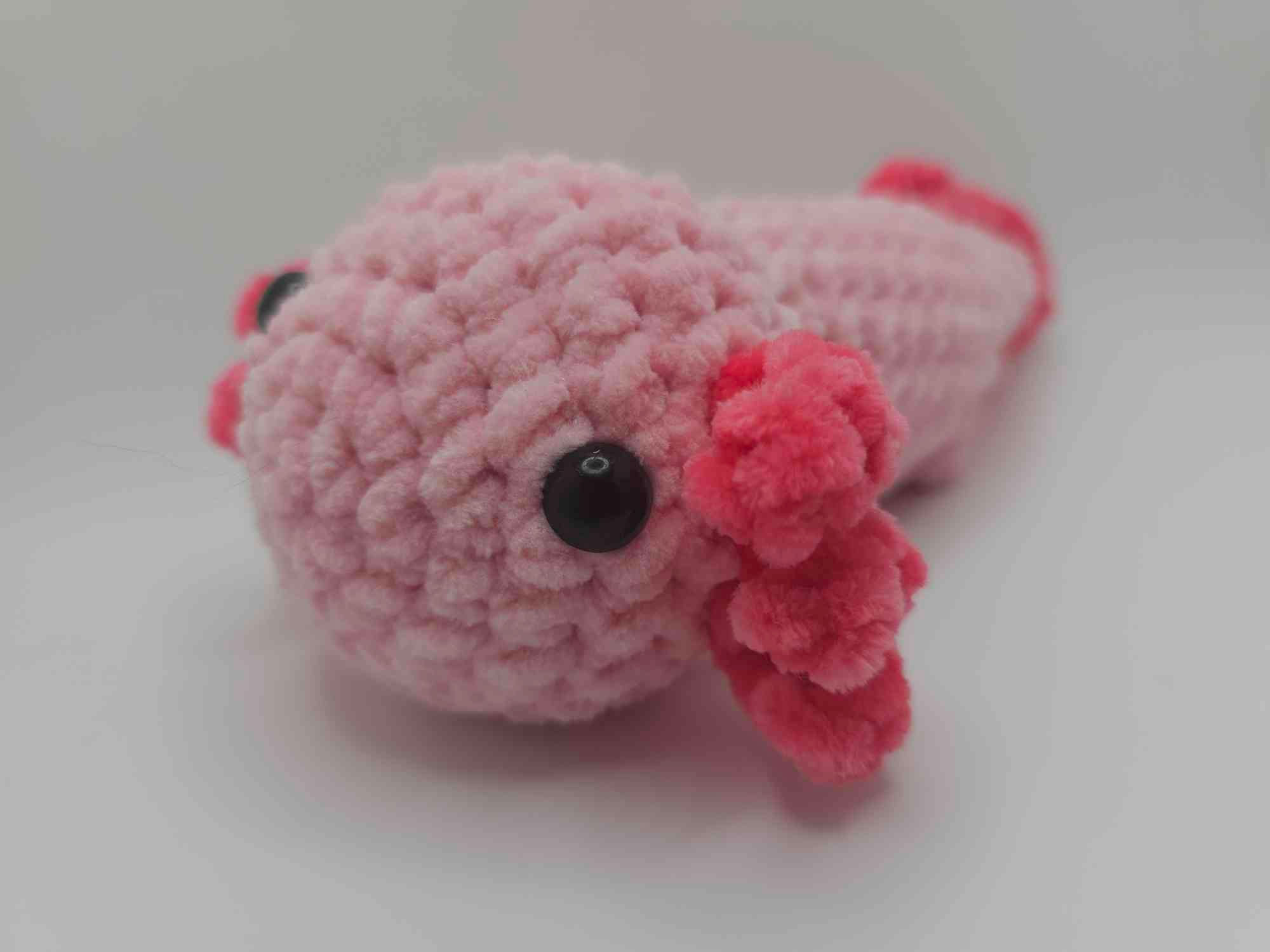 Handmade pink amigurumi axolotl plushie