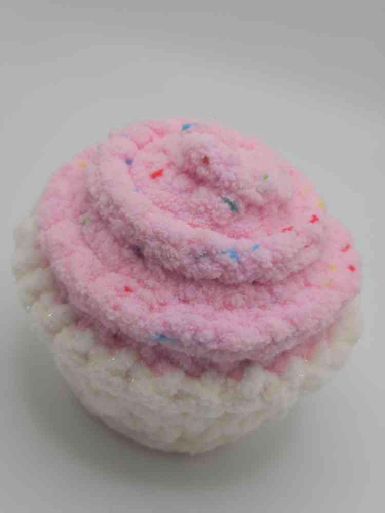 Small pink and white amigurumi crochet cupcake with sprinkles