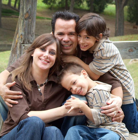 On location outdoor location in Coppell Texas park with a family of four that was all hugs by Lori Bell Photography.  