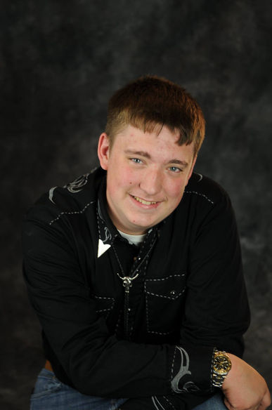 In studio senior portrait on gray backdrop with  by Lori Bell Photography 