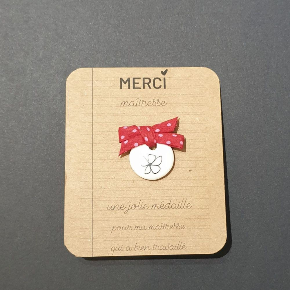 Pin's en porcelaine MERCI MAITRESSE