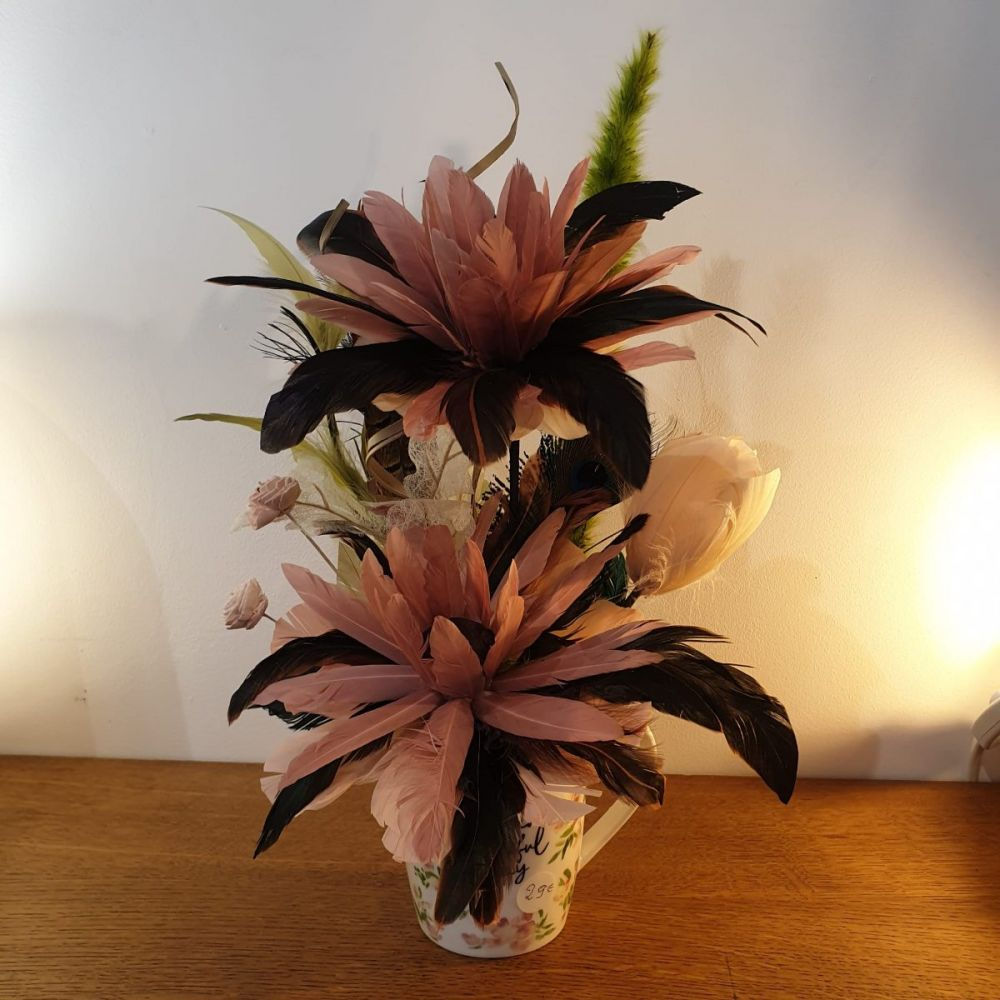 Composition de fleurs de plumes rose