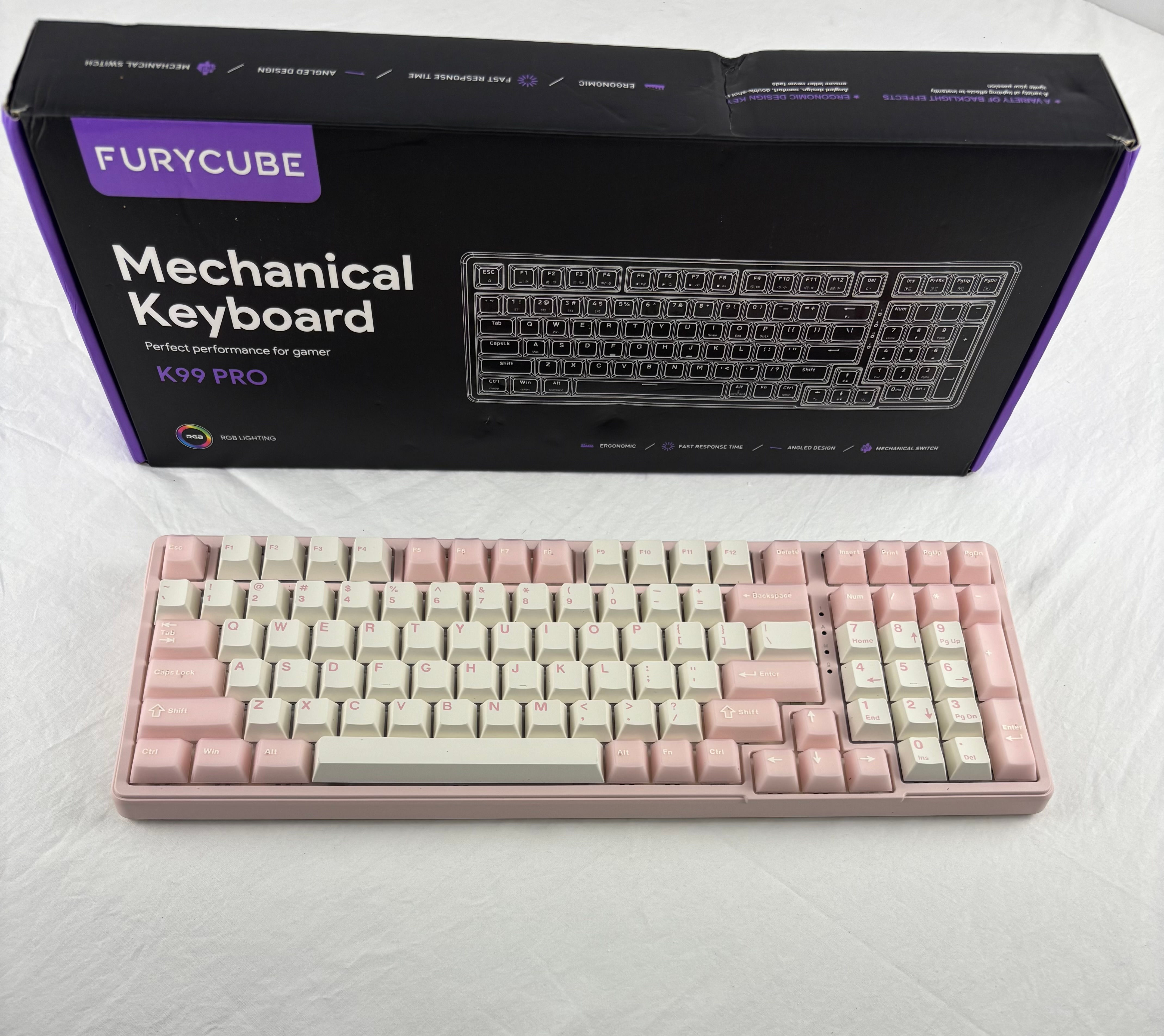 FURYCUBE K99 Pro gaming keyboard box showcasing RGB lighting and fast response times.