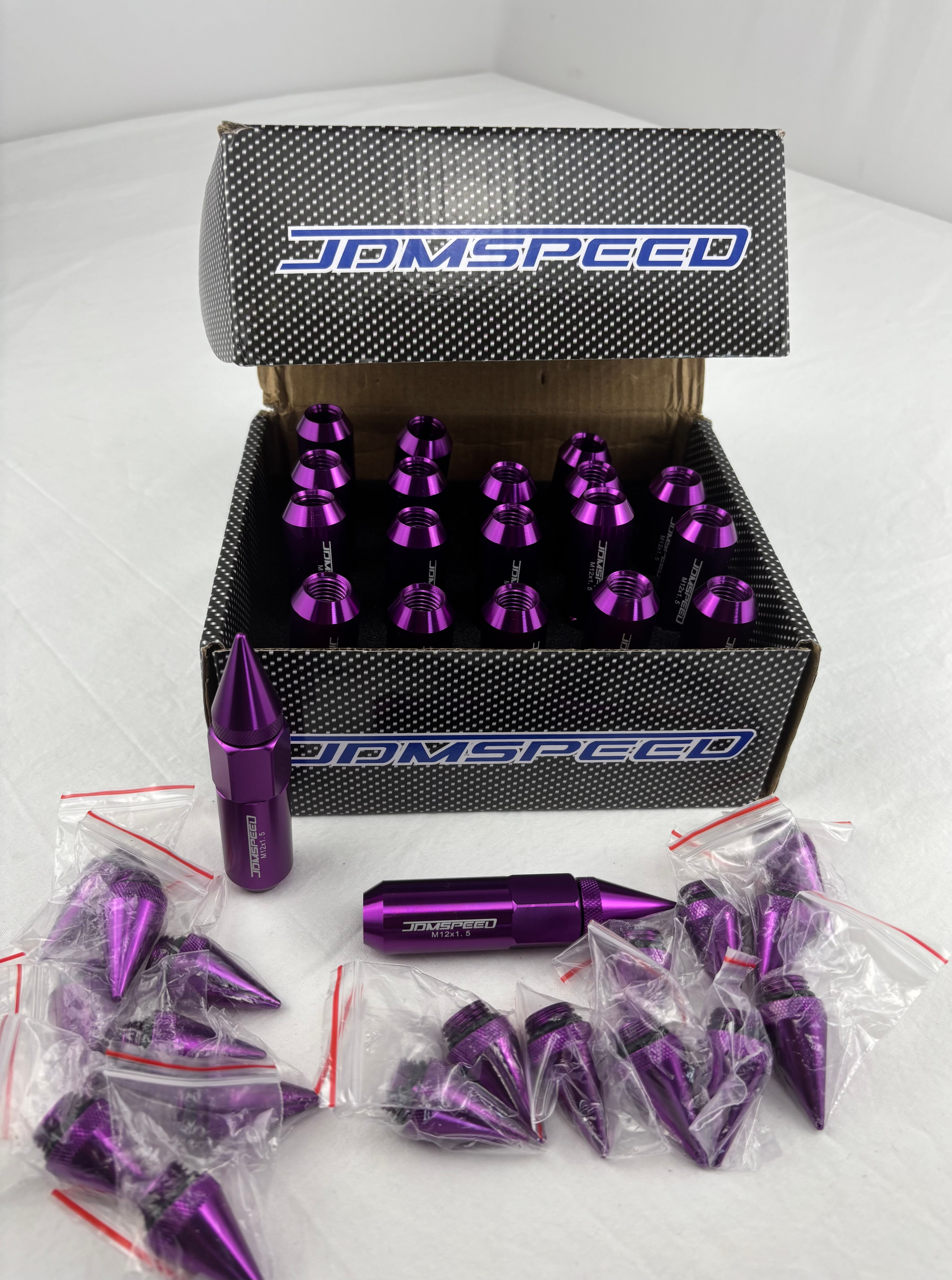 JDMSPEED purple 20 piece M12x1.5 spiked extended aluminum wheel lug nuts set.