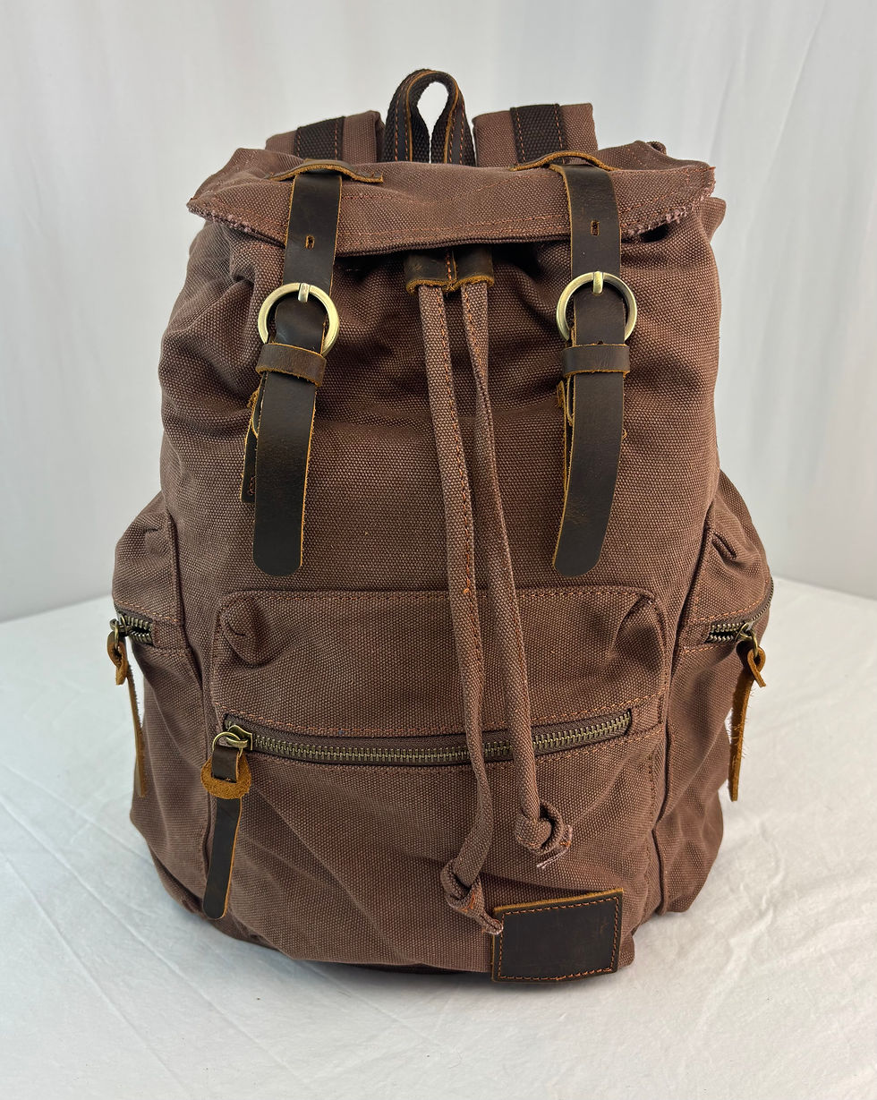 Front view of the coffee-colored AUGUR high-capacity vintage canvas rucksack showing its faux leather flap, retro brass hardw