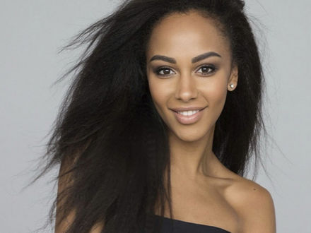 Professional model staff portrait for Los Angeles events featuring a confident female model with natural makeup and flowing hair, photographed in a clean studio setting. Ideal representation of Los Angeles model servers and bartenders, model hosts and greeters, and atmosphere models for upscale events, brand activations, corporate functions, private parties, red carpet receptions, and nightlife venues. This image highlights polished appearance, strong guest-facing presence, and premium Los Angeles model staff services.