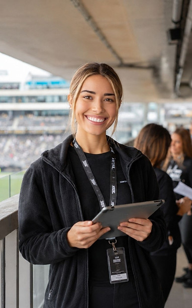 Professional general event support staff in San Francisco providing onsite operational assistance with a tablet during a corporate event, conference, networking event, or product launch, supporting event logistics, vendor coordination, guest services, production schedules, and smooth event execution.