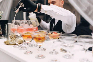 Professional bartender preparing cocktails for guests during a Las Vegas wedding reception. Beverage service specialist mixing and presenting drinks with attention to timing, presentation, and guest experience for wedding celebrations, private receptions, and luxury hospitality events.