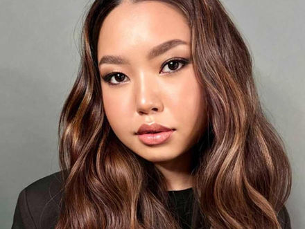 Elegant Los Angeles hostess with polished makeup and long wavy hair, photographed in a professional portrait setting. This image represents premium LA welcome staff, hostess services, and front-of-house event personnel for upscale corporate events, luxury brand activations, private parties, hotels, galas, and VIP receptions in Los Angeles. Professional event hostess skilled in guest greeting, registration support, check-in assistance, and brand representation. Ideal for clients hiring Los Angeles hostess staff, welcome staff, and event support teams focused on presentation, confidence, and guest experience.