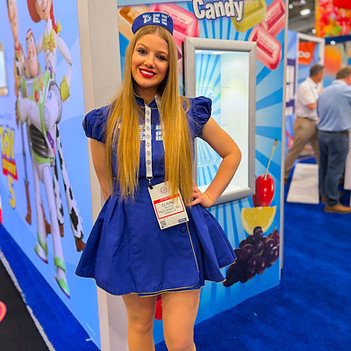 Los Angeles costumed performer representing a themed consumer brand activation at a trade show exhibit. Dressed in custom promotional attire, the performer attracts attention, enhances booth visibility, and helps create an immersive guest experience for attendees exploring the convention floor.