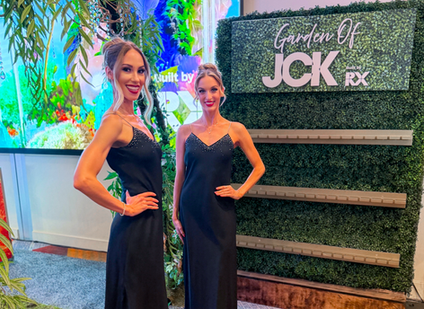 Los Angeles model hostesses welcoming attendees at a premium convention hospitality lounge during JCK. Dressed in elegant formal attire, the hosts support guest reception, networking interactions, VIP engagement, and attendee assistance while helping create a polished and professional event environment.