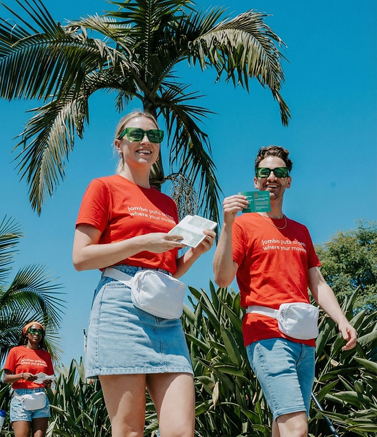 Los Angeles street team members distributing promotional materials during an outdoor consumer awareness campaign. The outreach team engages directly with the public, increases local brand visibility, and supports grassroots marketing efforts in high-traffic destinations throughout Los Angeles.