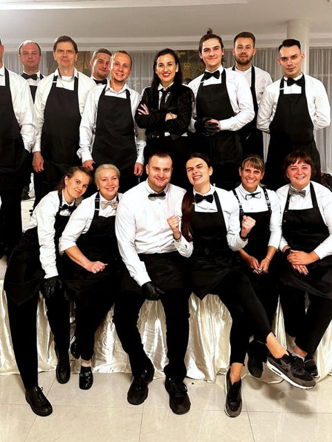 Event captain standing with a large hospitality team at a Las Vegas corporate event. Responsible for supervising event staff, coordinating service operations, managing team communication, and ensuring consistent guest experience throughout conferences, galas, networking events, and private receptions.