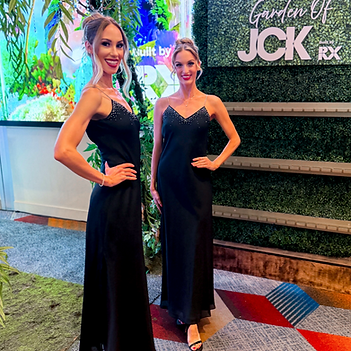Two booth model hosts at the JCK Las Vegas jewelry trade show creating a polished brand presence for exhibitors. Their role combines attendee engagement, luxury hospitality, guest interaction, and visual brand representation designed to attract visitors and encourage meaningful booth conversations.