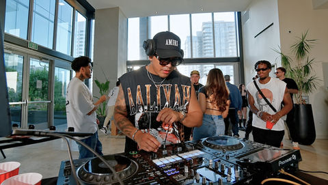 A brand activation DJ in Los Angeles performs live during an influencer marketing event, mixing music for guests gathered around a modern experiential activation. Corporate event DJ services create an energetic atmosphere for product launches, brand activations, influencer events, networking receptions, experiential marketing campaigns, and promotional events.