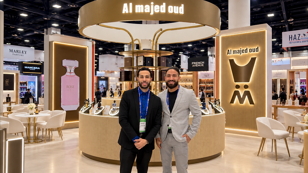Two professional trade show brand ambassadors representing a Middle Eastern fragrance company at ASD Market Week in Las Vegas. Las Vegas trade show staff engage attendees, introduce perfume products, offer fragrance samples, start conversations, and help exhibitors capture qualified leads.