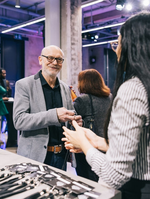 Executive conference badge verification staff in San Francisco assisting attendees with credential checks, badge distribution, and secure event entry at leadership summits.