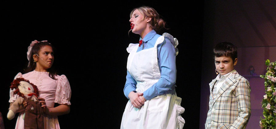 Mary Poppins scolds Jane and Michael, who scowl in response, 