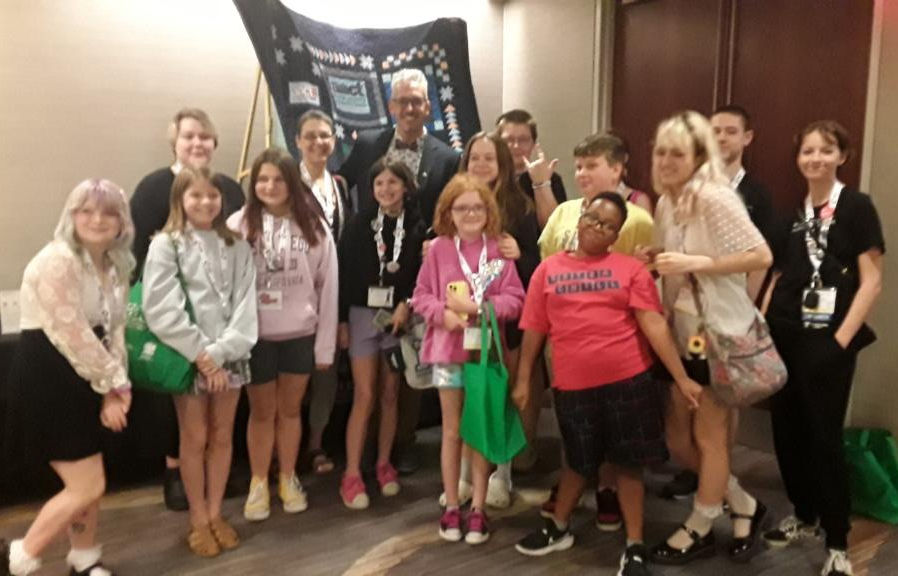 The cast and crew of Mockingbird standing around Ben Cameron, Broadway actor.