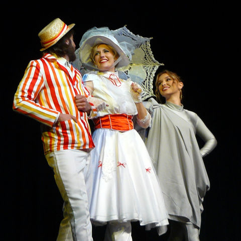 Bert, Mary Poppins, and Nelius dancing in their Jolly Holiday costumes