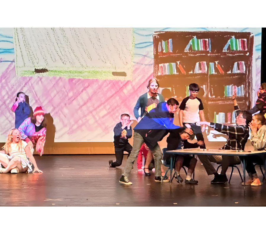 Junie B. Jones rumpling Jim's hair while the other kids watch in amazement