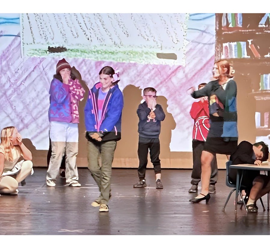 Mrs. and the other kids with their hands over their mouths in shock, as Mrs. accidentally repeats the name Junie B. called Jim.