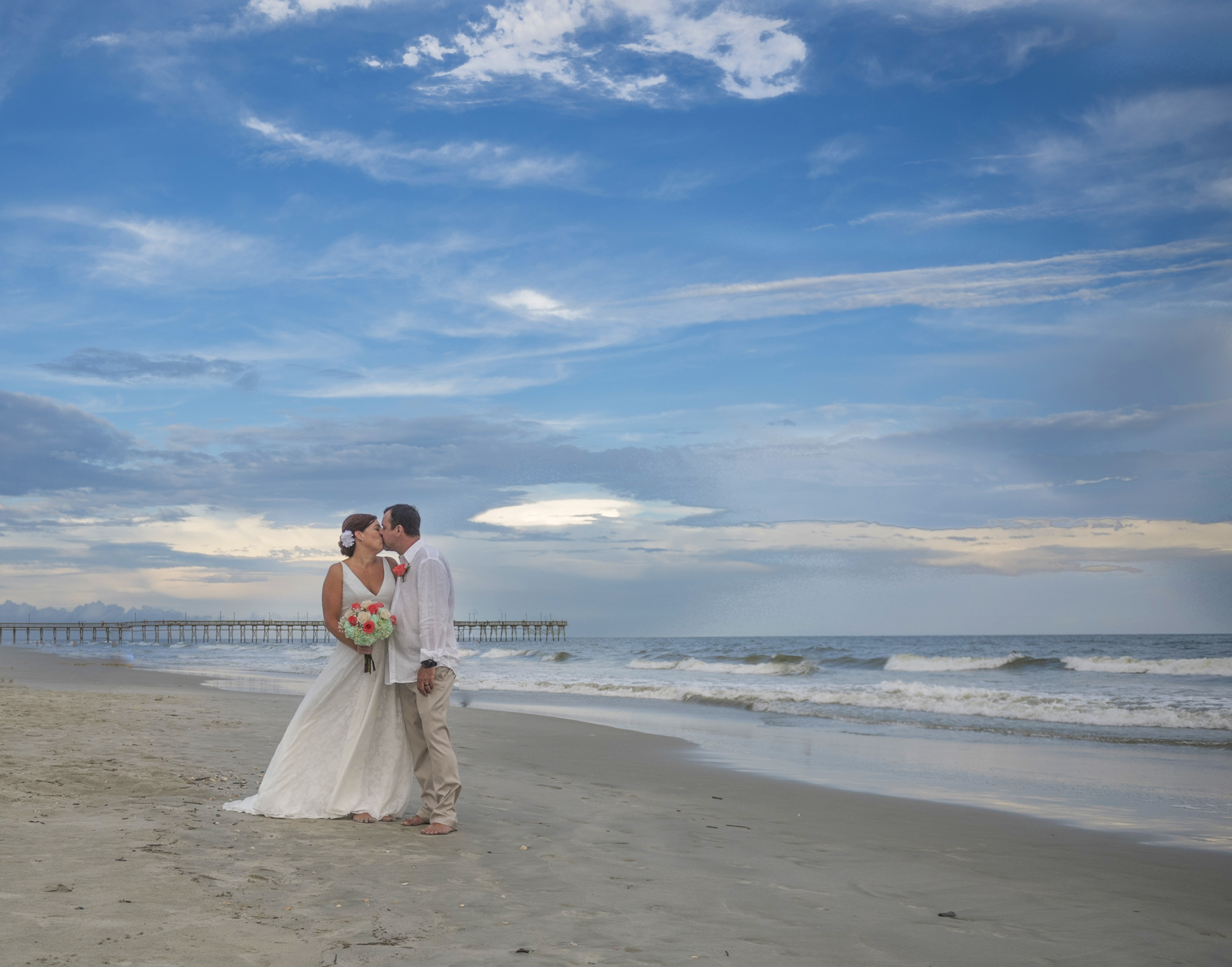 Frank Hart Photography Ocean Isle Inn wedding at Ocean Isle Beach, couple kissing at sunset