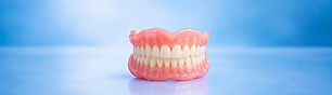 a pair of complete dentures on display