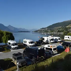 The new Driftaway camping ground at Frankton in Queenstown. I have stayed in a car, and in a tent. Dogs are welcome. There are bbqs, a playground, breathtaking views, swimming in the lake and a hot tub for adults.