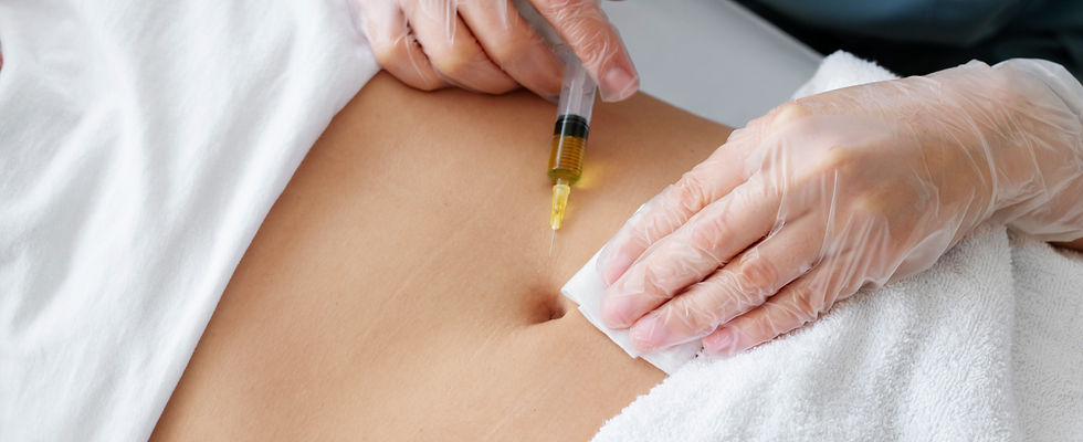 high angle healthcare professional injecting belly