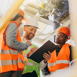 three-people-discussing-plan-factory.jpg