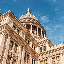 low-angle-shot-texas-capitol-building-blue-beautiful-sky-austin-city-texas.jpg