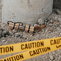 near-bridge-support-dangerous-explosive-lying-ground-yellow-caution-tape-front.jpg