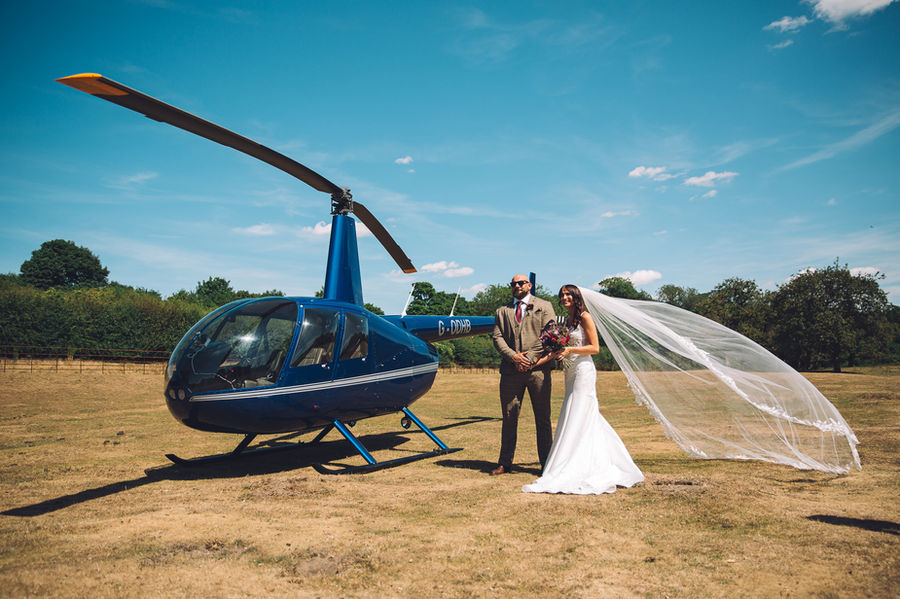 Helicopter wedding bride and groom field countryside summer