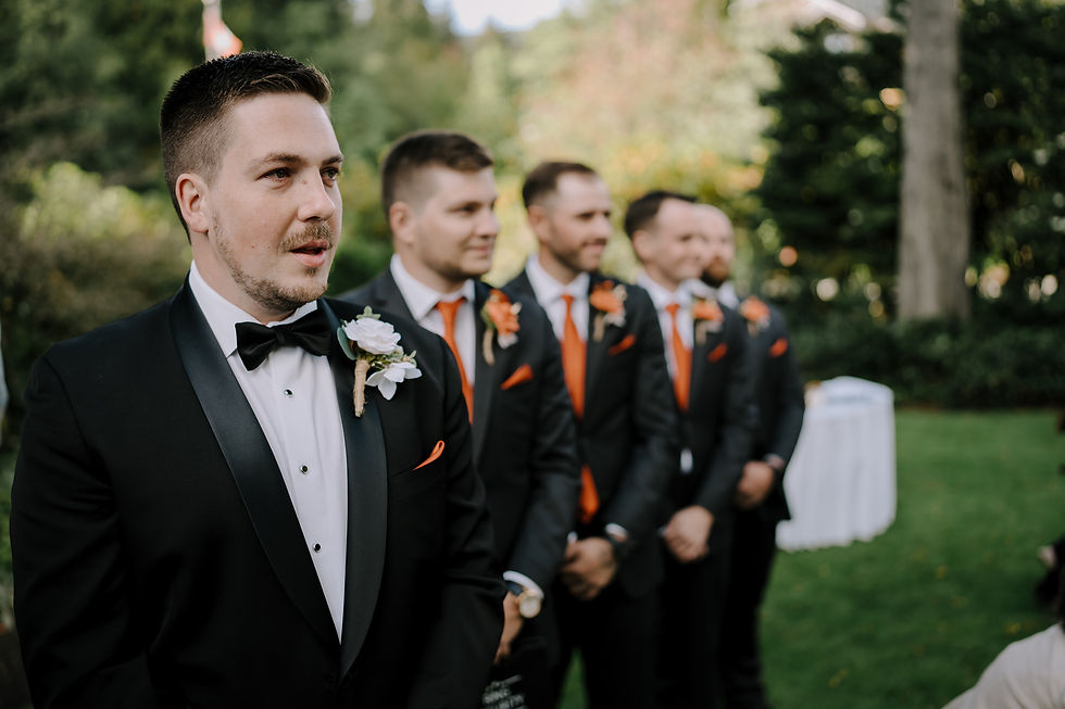 Grooms reaction to the bride walking down the aisle.