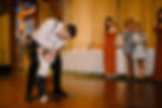 Father-Daughter Dance: Bride dancing with her father under warm lighting at the reception.
