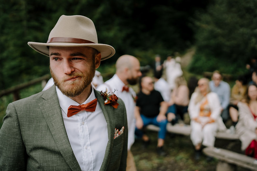 Groom is emotional as the bride walks down the path into the ceremony. First look.