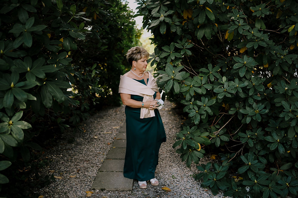 Mother of the groom waiting for the ceremony to start. We can feel the emotions in this image.