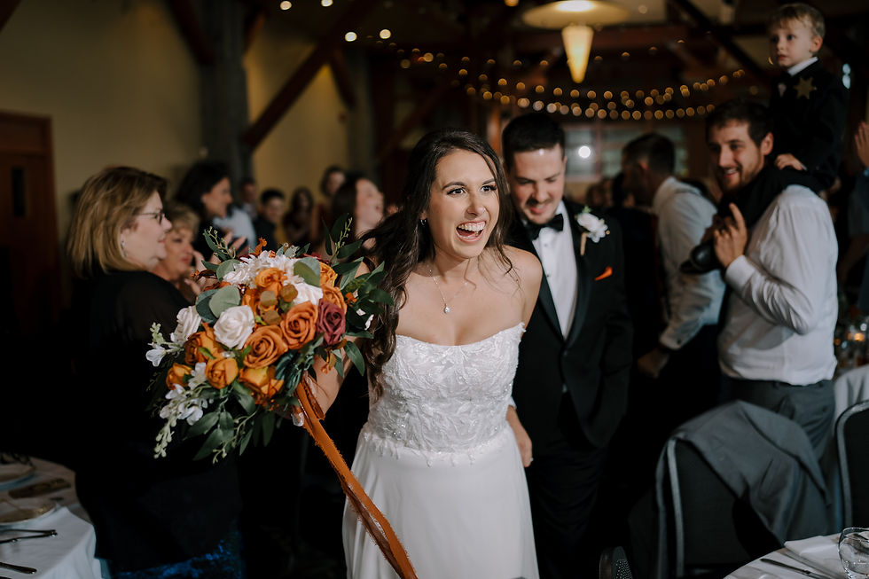 The newly weds walking into their reception.