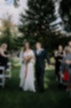 Bride and her father walking down the aisle.