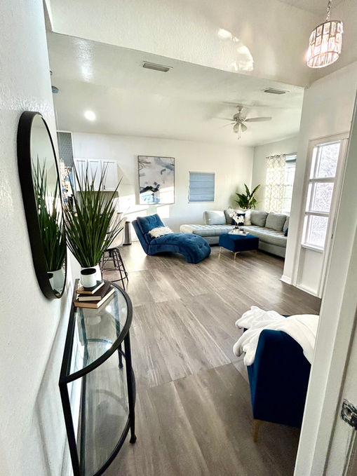 designed living room with white walls and blur furniture