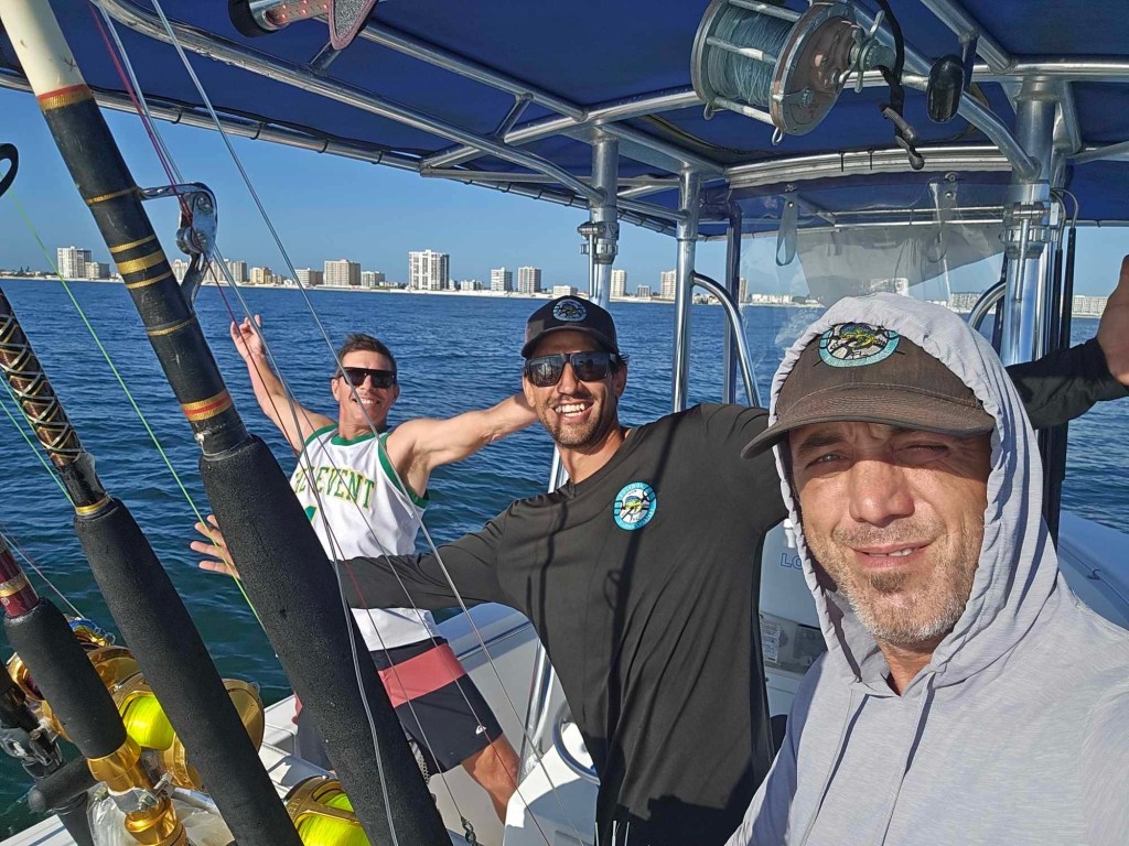 3 men fishing on a boat in Florida