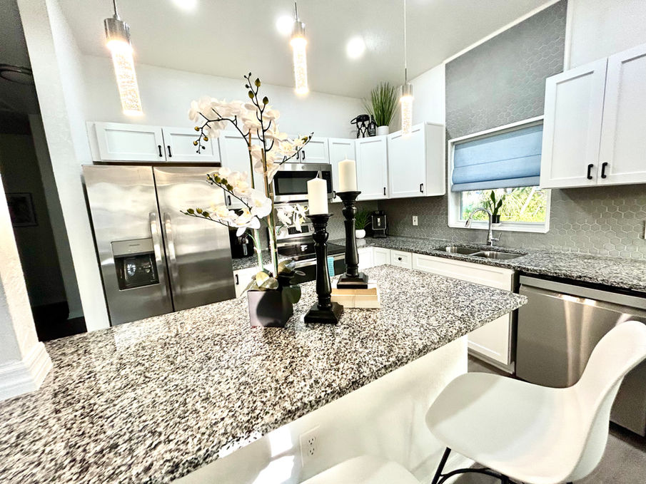 kitchen island with steel appliances