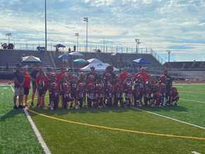 football team on the field taking a picture