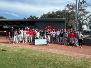 donating a check to a baseball team
